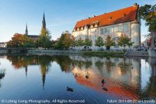 uppsala cathedral in morning sunlight reflected by the fyris river.jpg
